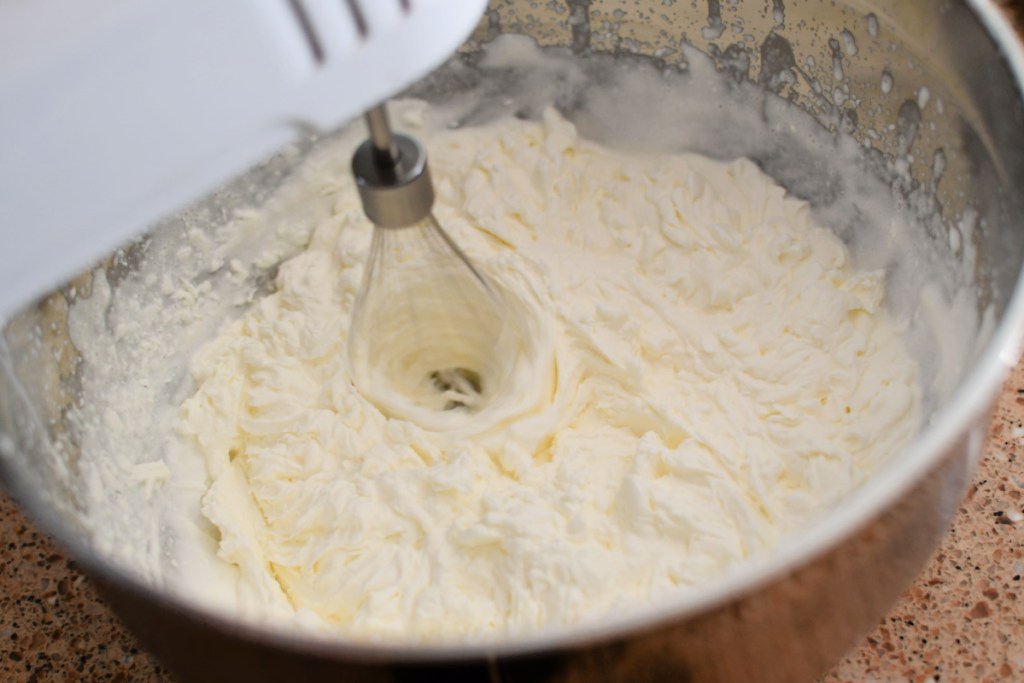 whipping heavy cream in a bowl