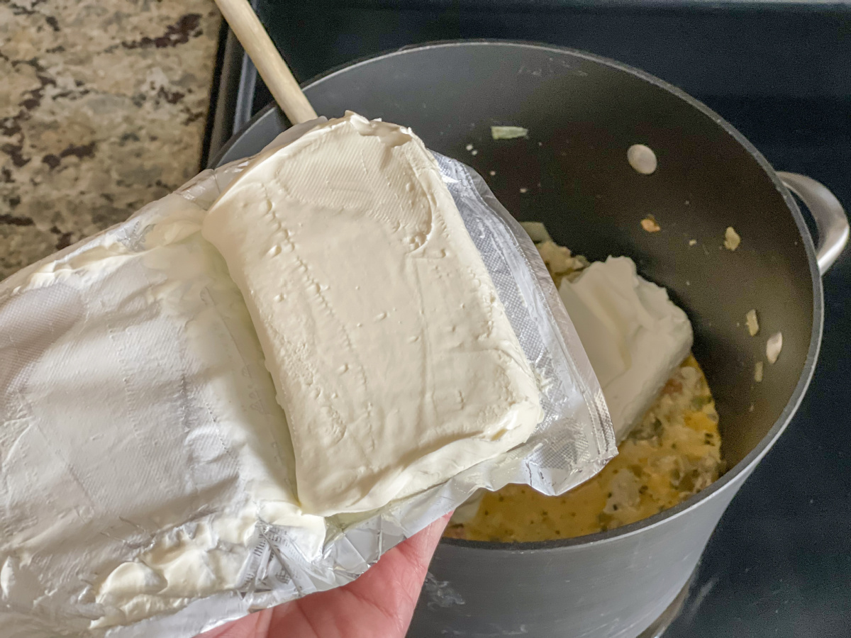 adding cream cheese to pan