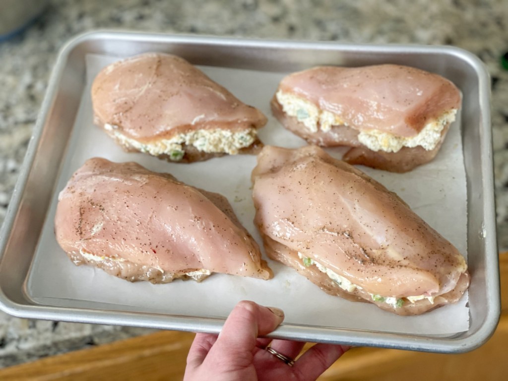 keto cream cheese stuffed chicken breasts going in the oven