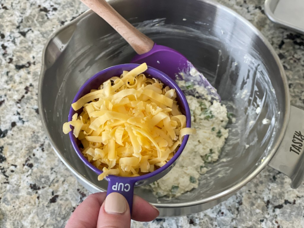 adding shredded cheese to keto cream cheese filling