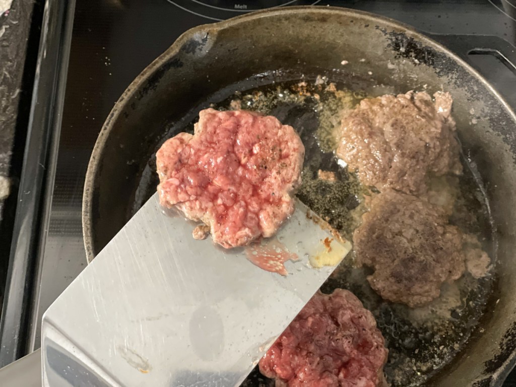hamburger patty on a spatula 