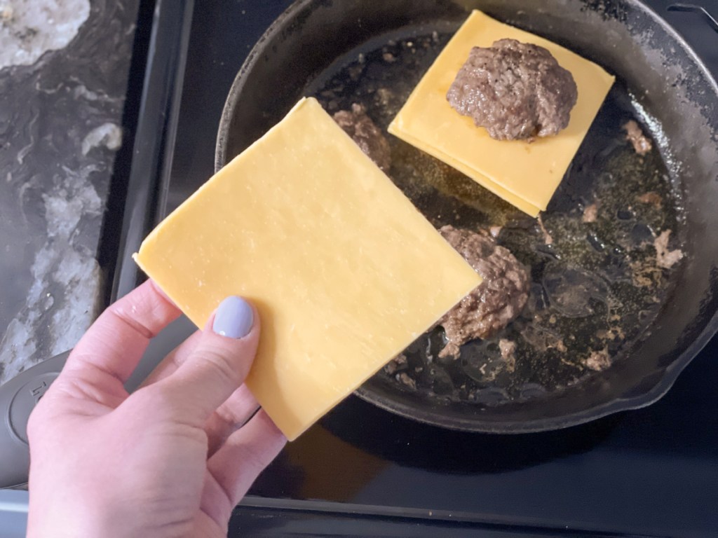 adding cheese to In-N-Out Flying Dutchman keto burger