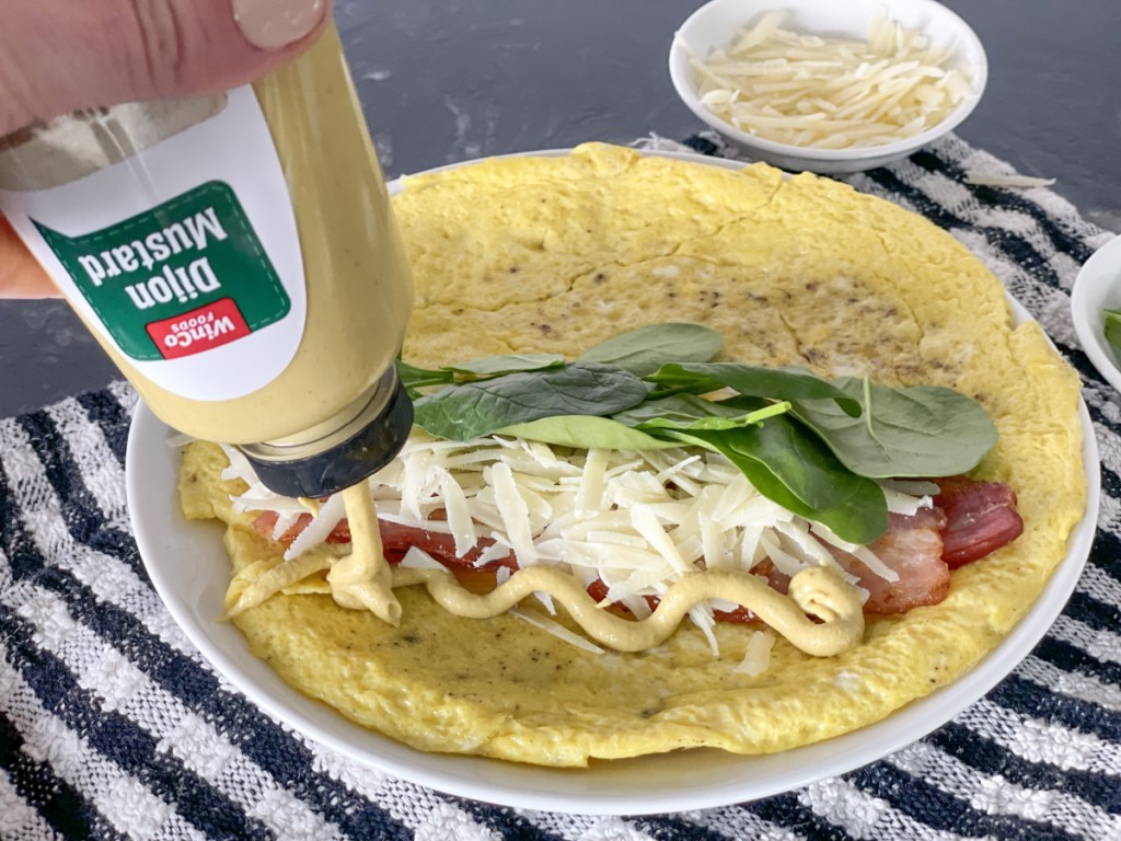 adding dijon mustard to keto breakfast burrito