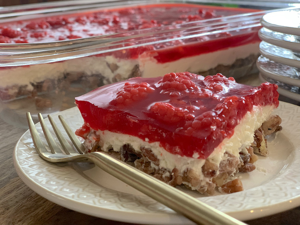 Keto Raspberry Jello Delight Dessert slice on plate with fork 