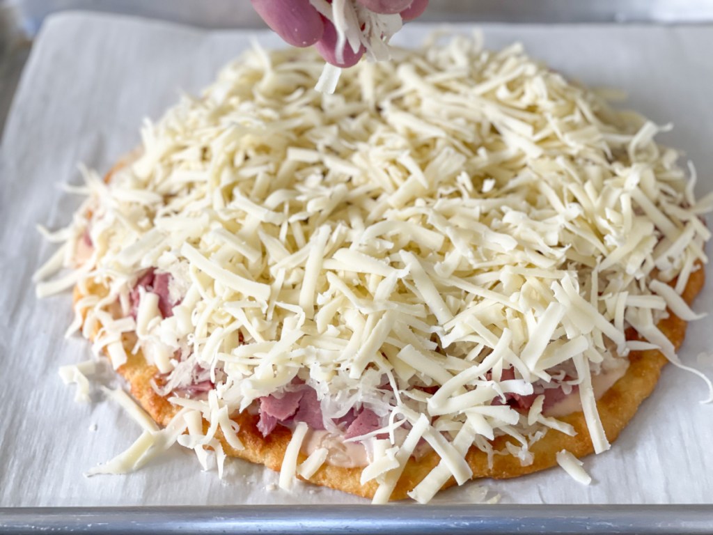 adding Swiss cheese to keto reuben pizza
