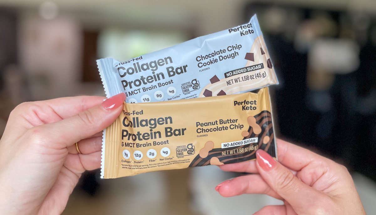 Hand holding up two Perfect Keto Collagen Protein Bar