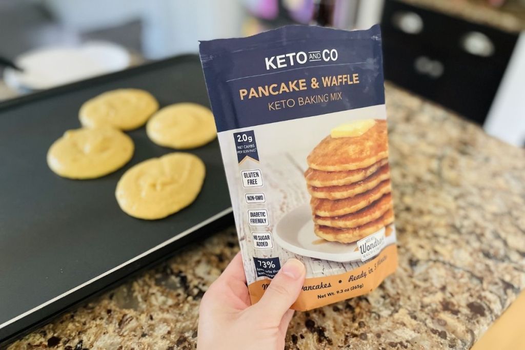 Keto and Co pancake and waffle mix in front of keto pancakes