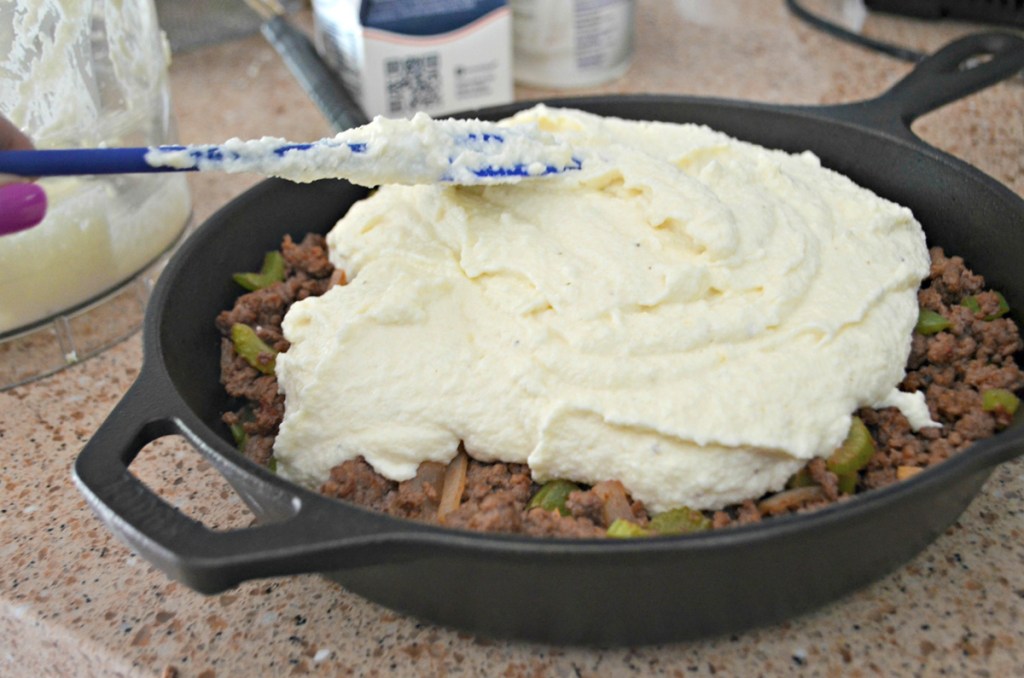 spreading cauliflower on keto shepherd's pie
