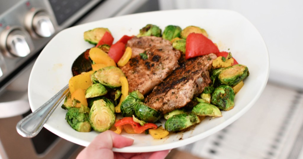 plate with keto pork chops and veggies