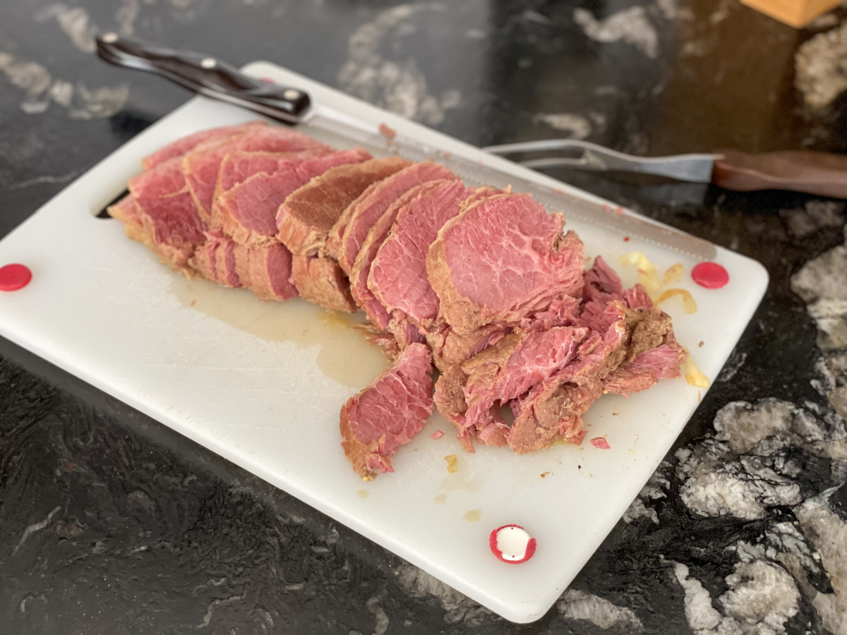 sliced corned beef on cutting board