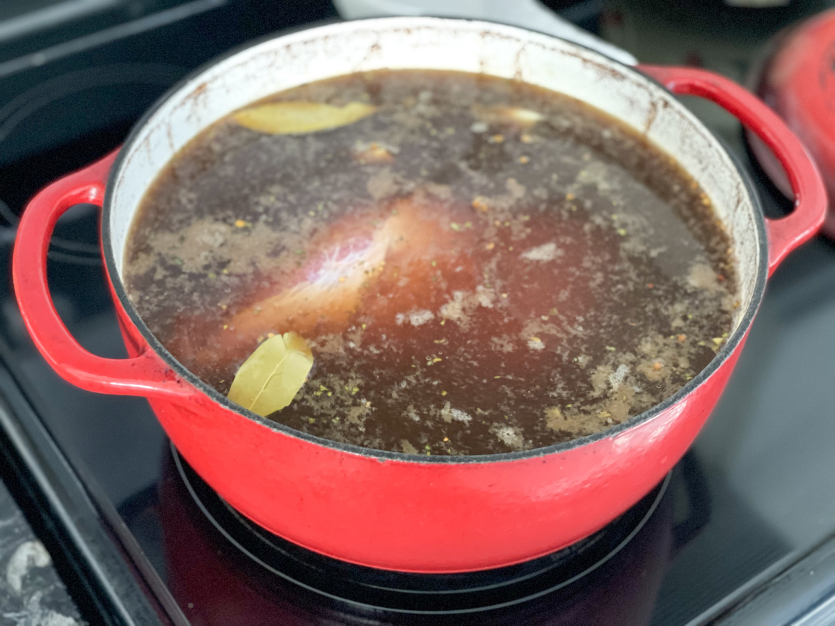 keto corned beef simmering in dutch oven