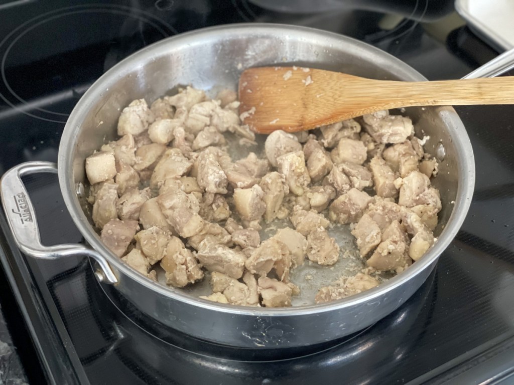 cooked cubed chicken in a skilet 