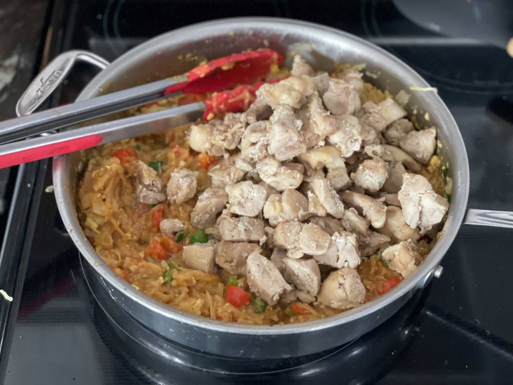 adding chicken to keto pad thai with spaghetti squash
