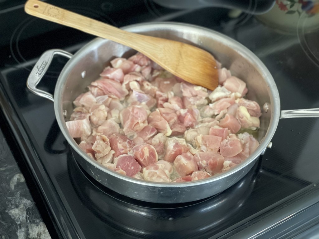chicken cooking in a skillet 