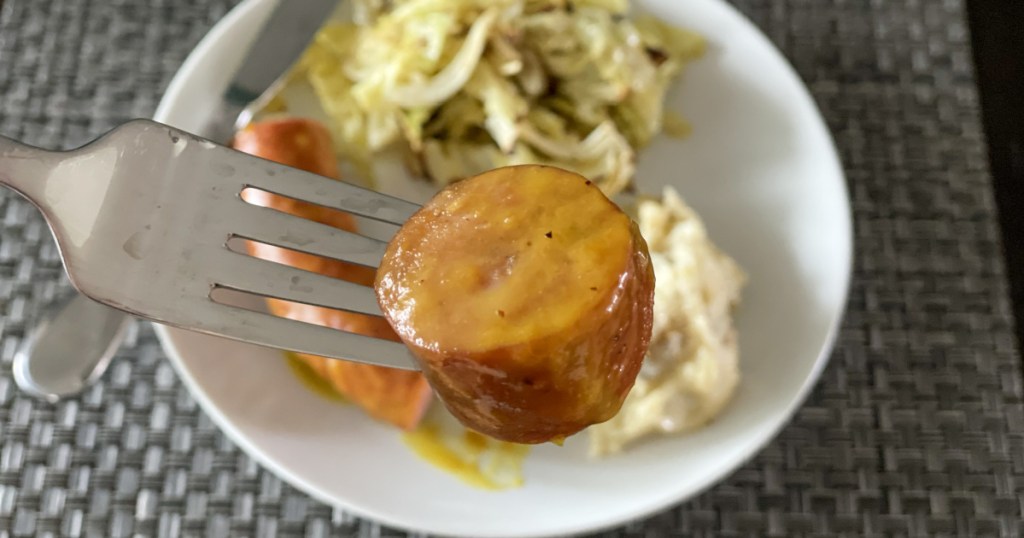 slice of Sausage with Apricot Mustard glaze on a fork