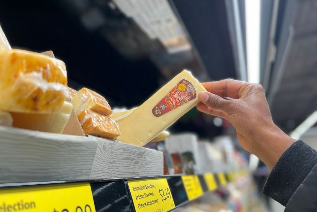 Grabbing a block of cheese from the shelf at ALDI