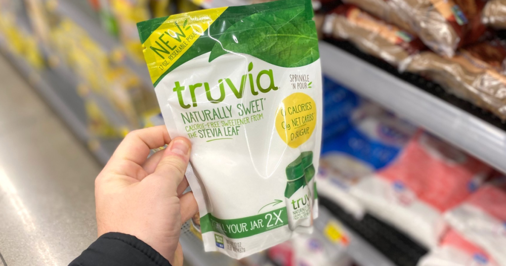 holding a bag of Truvia sweetener