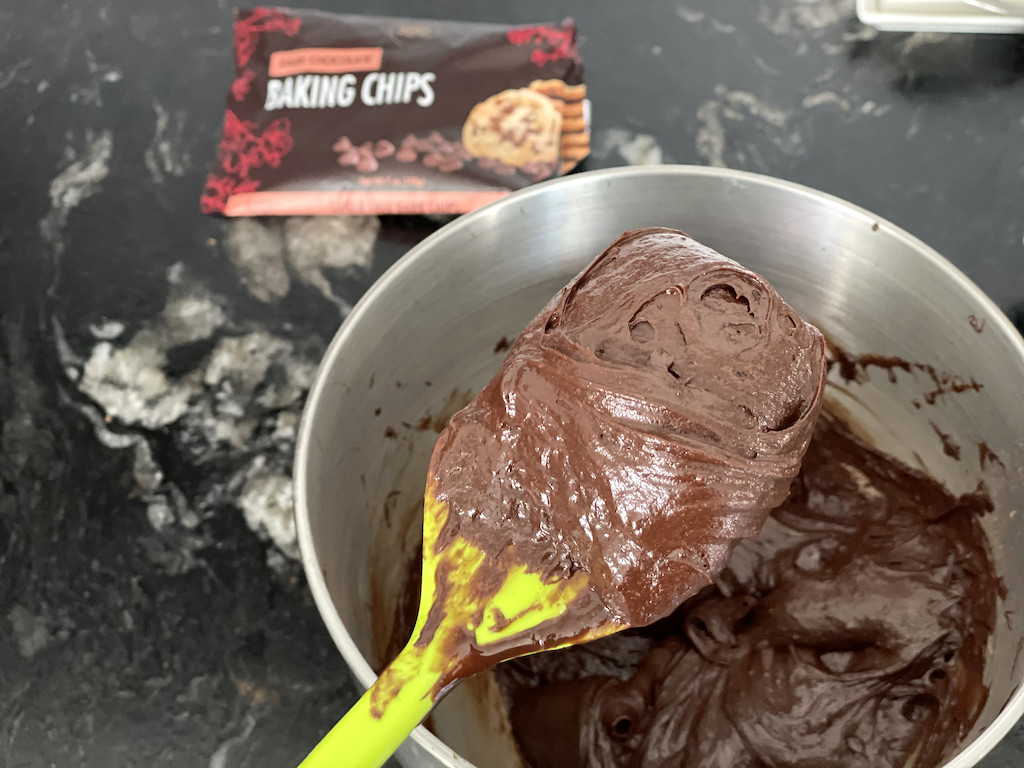 mixing keto flourless chocolate cake in bowl