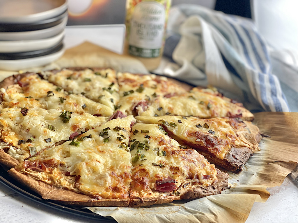 keto Reuben pizza sliced on platter 