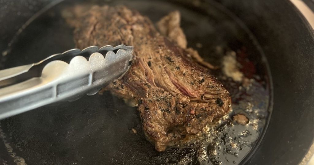 piece of steak in a pan