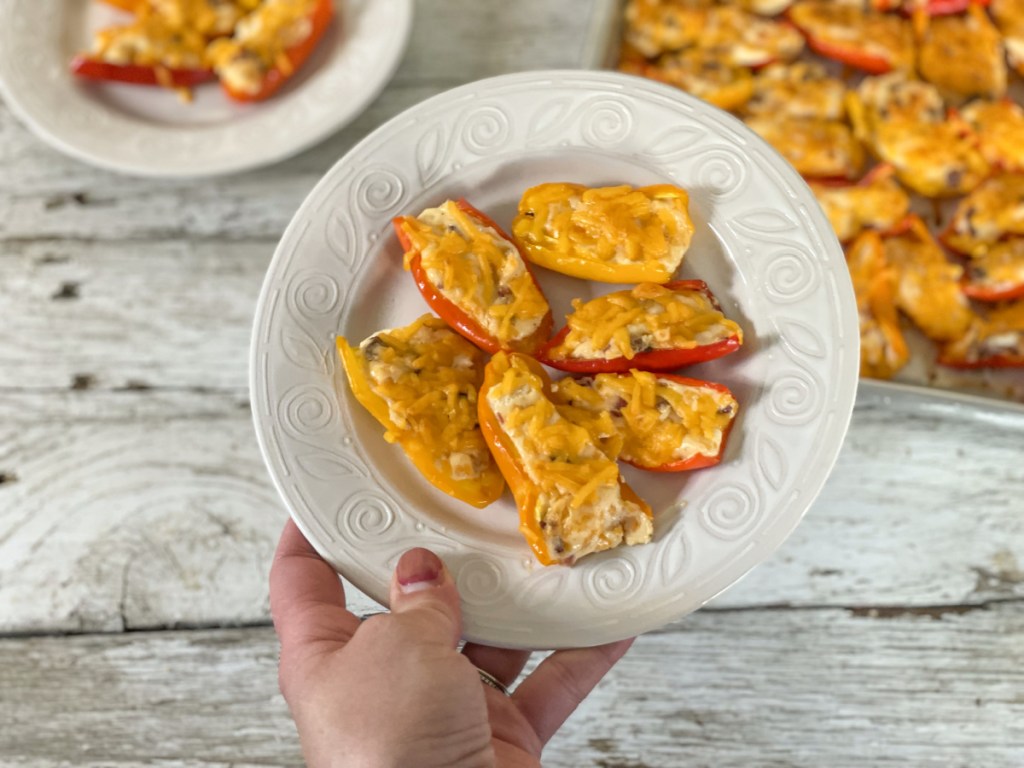 cream cheese stuffed mini peppers on a plate