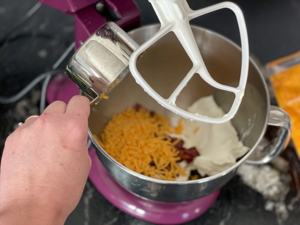adding cheddar to cream cheese mixture