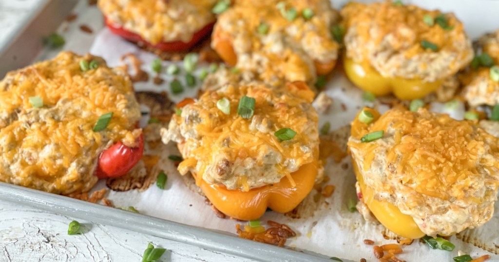 cream cheese and chicken stuffed bell peppers on baking sheets