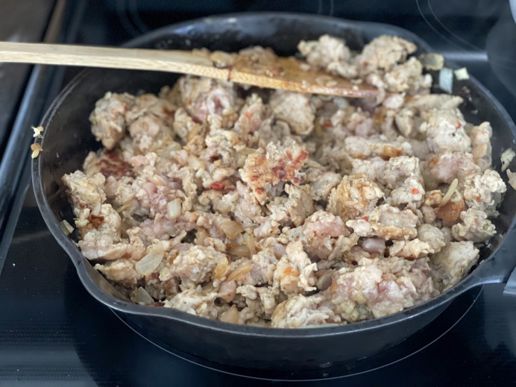 cooking chicken sausage in a skillet 