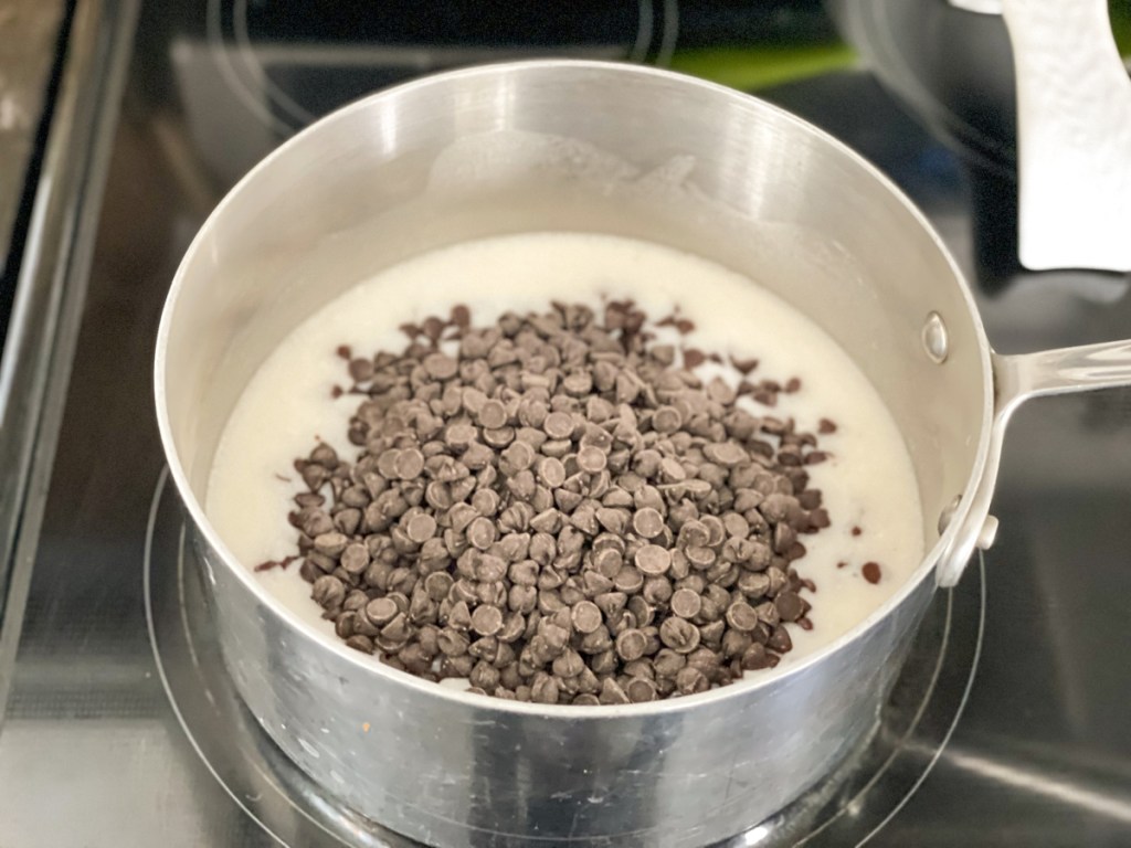 chocolate chips in a sauce pan with coconut milk