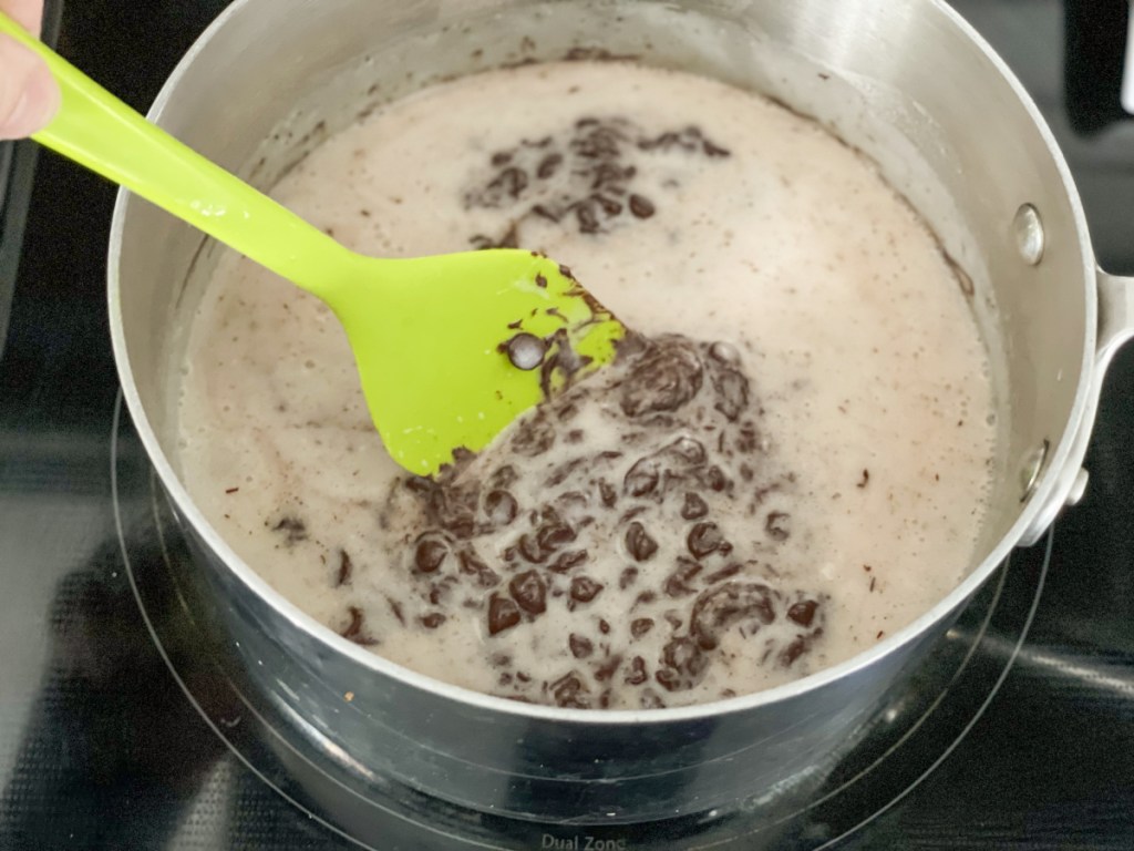 melting together keto chocolate chips and coconut milk