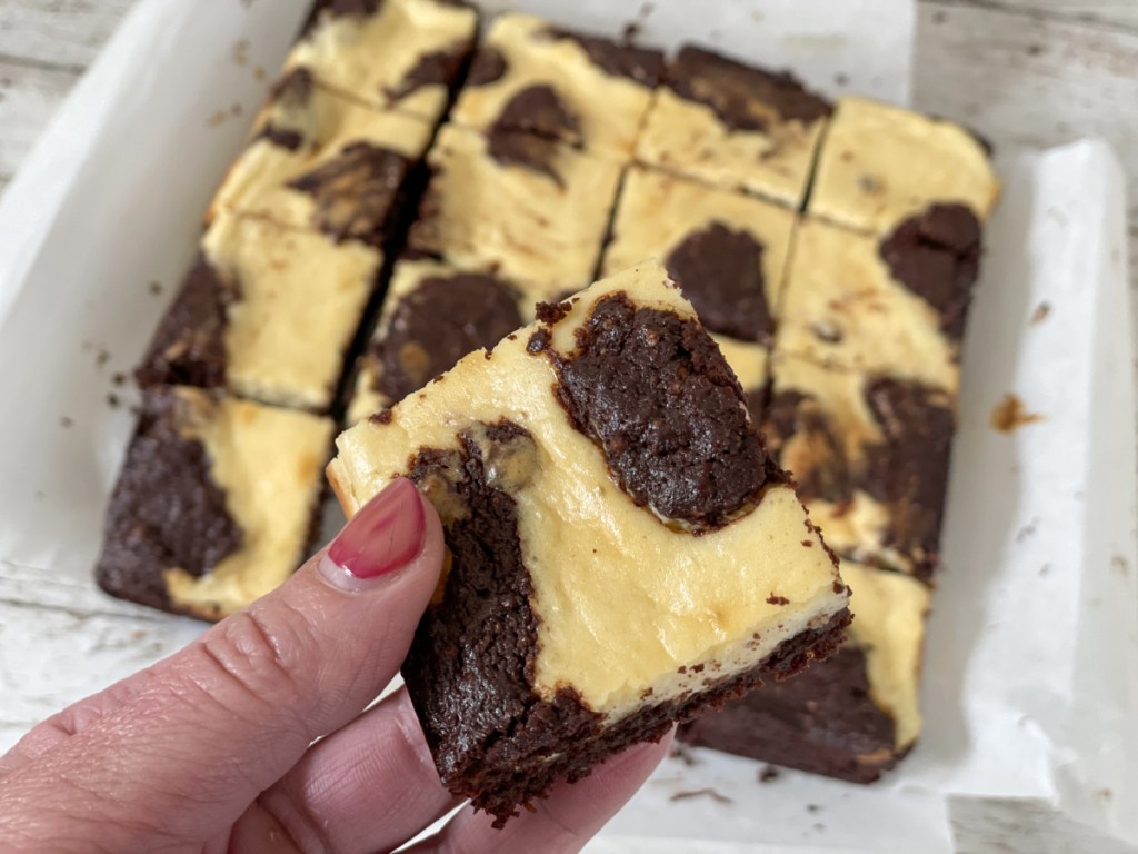 holding a keto cream cheese brownie