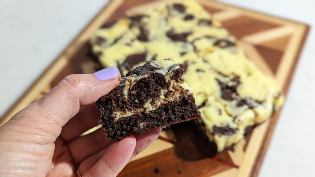 holding a keto cream cheese brownie