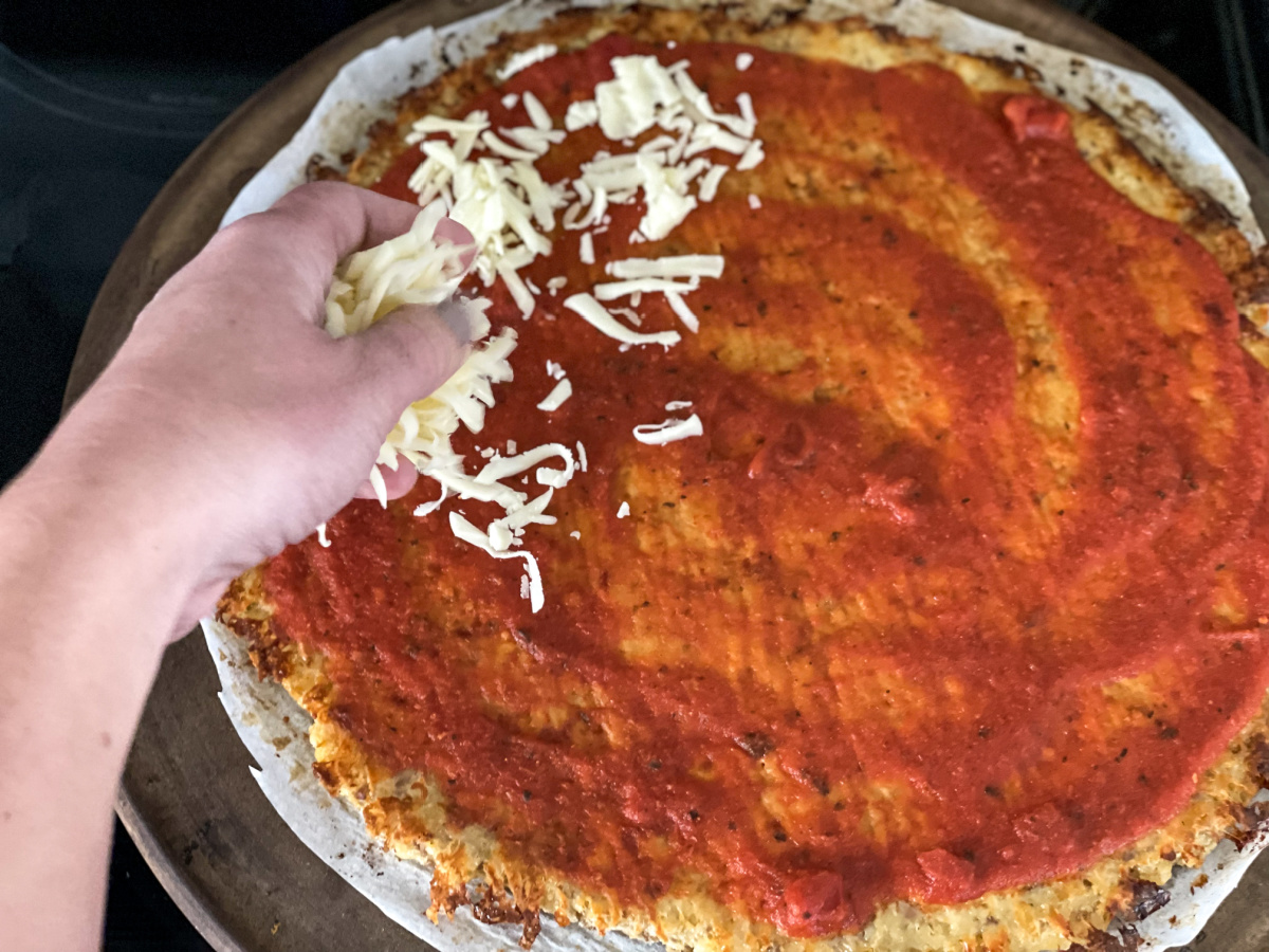 adding cheese on top of crust