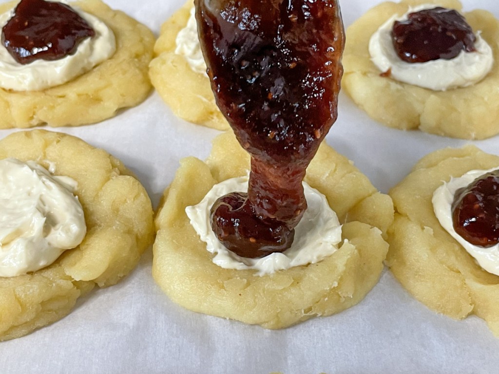 putting strawberry jam on keto strawberry cream cheese danishes 