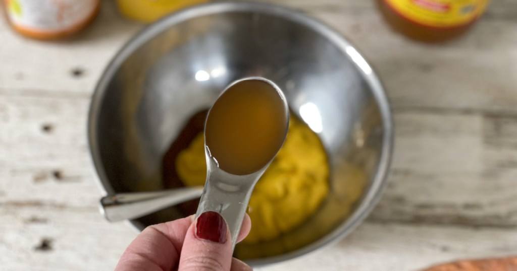 adding apple sider vinegar to a bowl