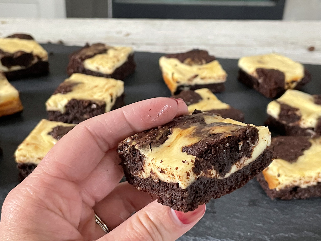 holding keto cream cheese brownie 