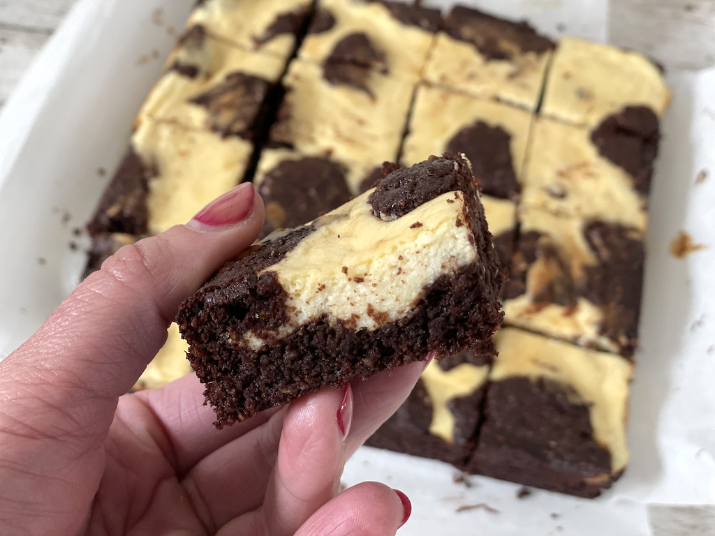 holding keto cream cheese brownie 