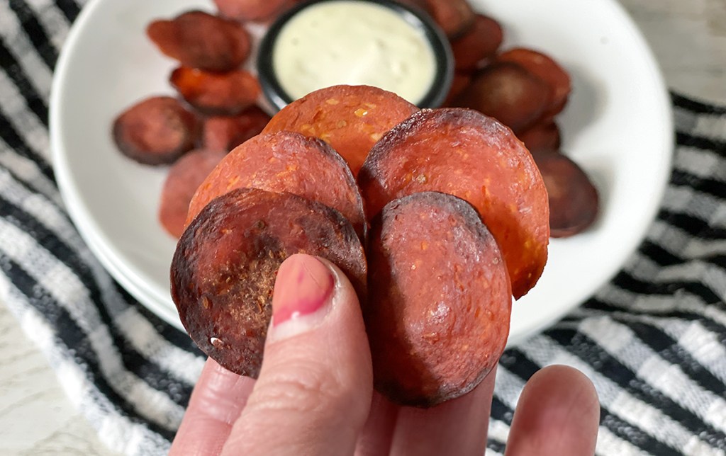 keto pepperoni chips in hand