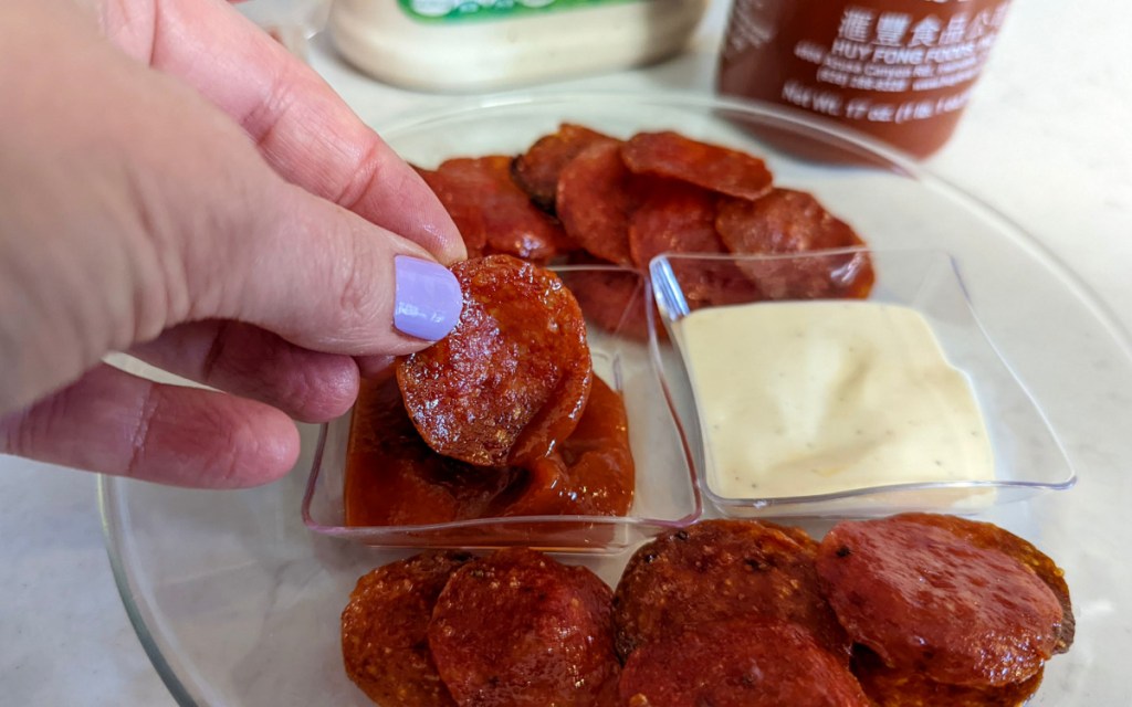 pepperoni chips dipped in sriracha