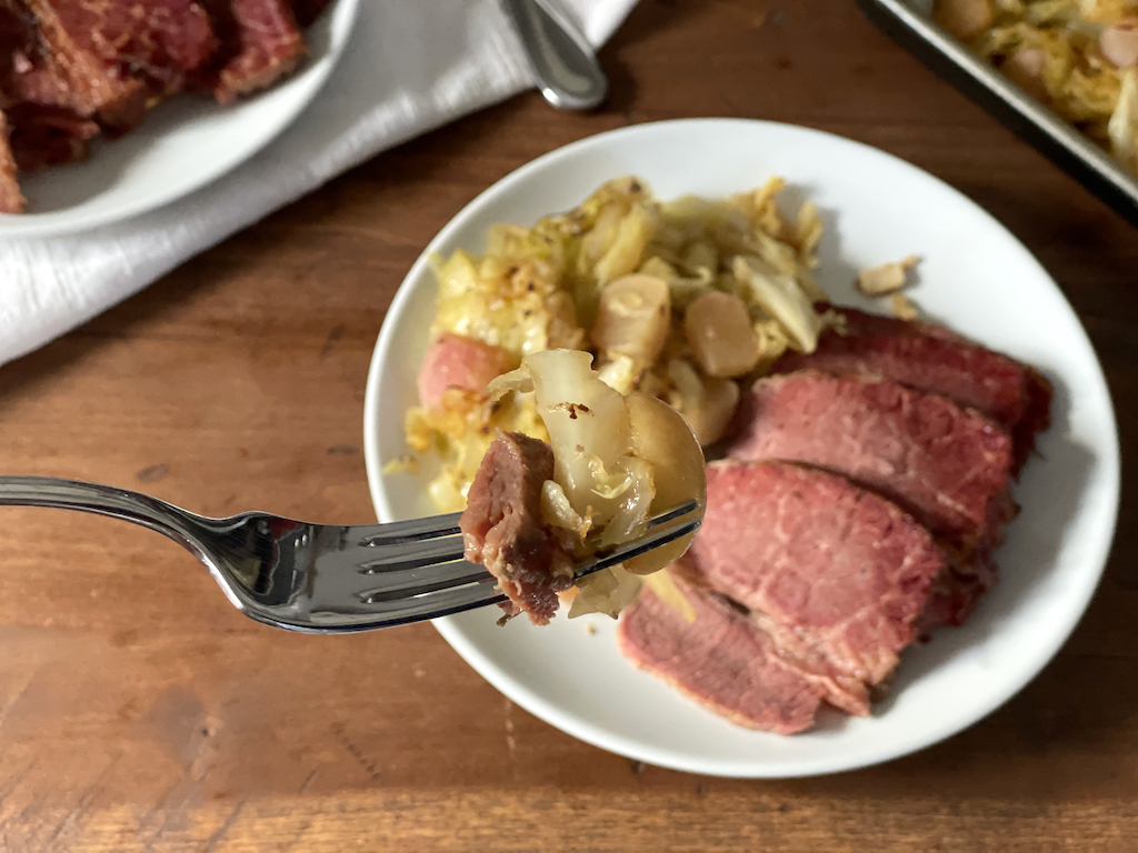 taking bit of corned beef and cabbage 