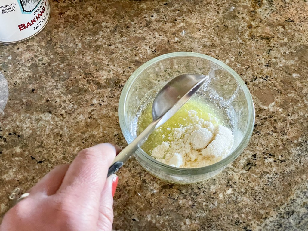 adding almond flour to a bowl