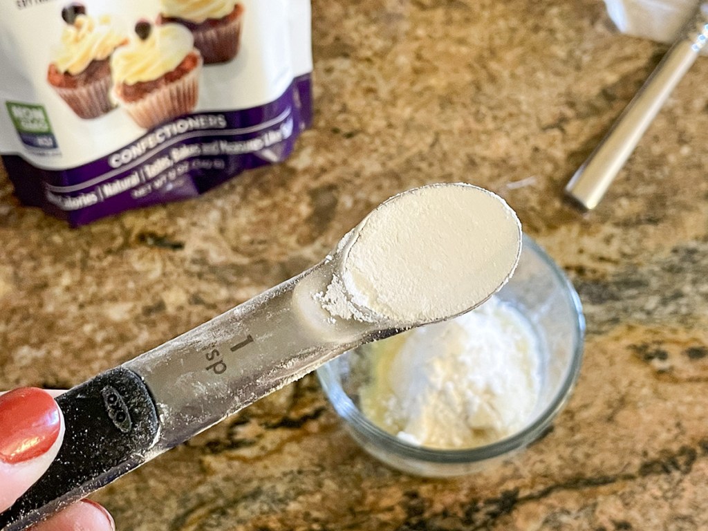 adding keto sweetener to a bowl