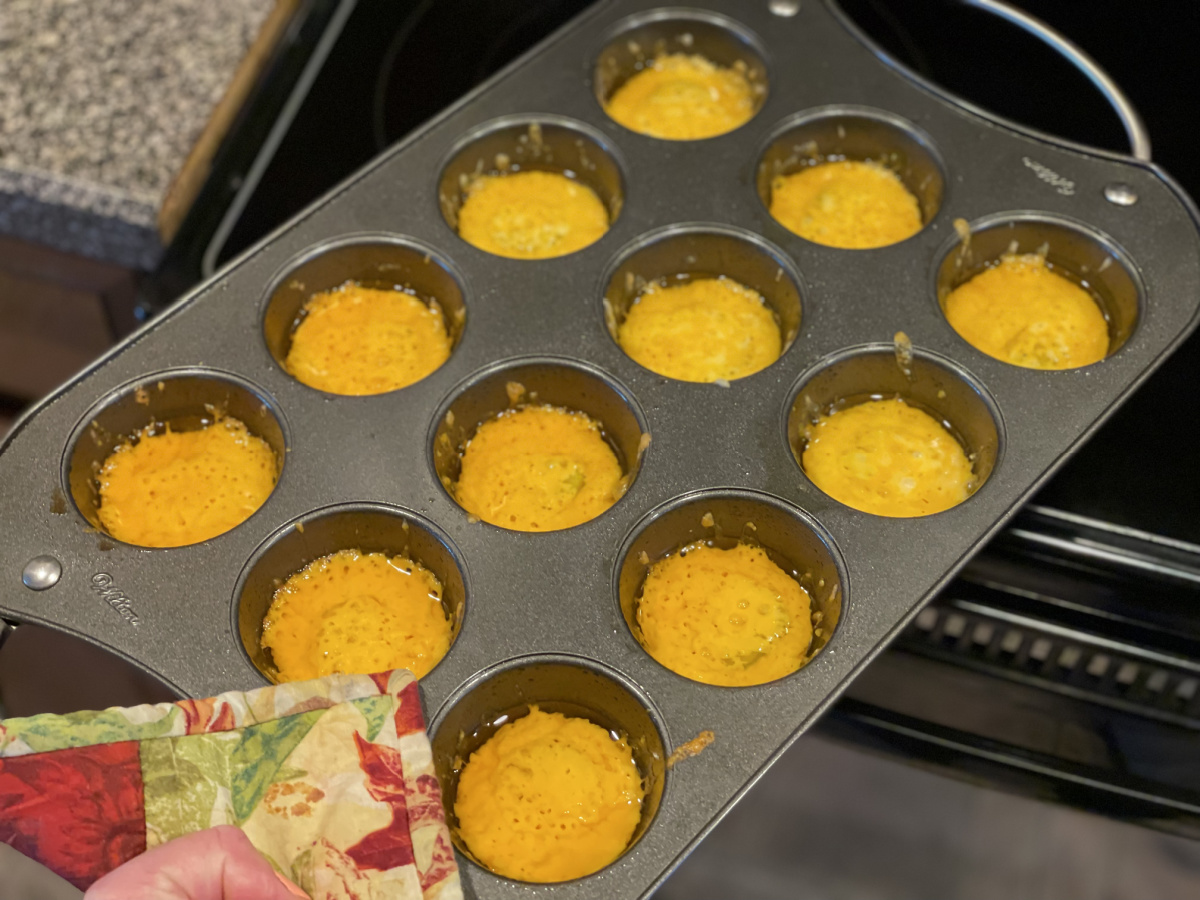 taking cheese pickle chips out of the oven