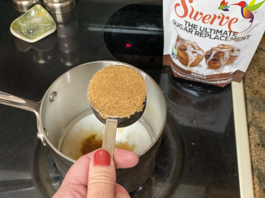 adding brown keto sweetener to saucepan