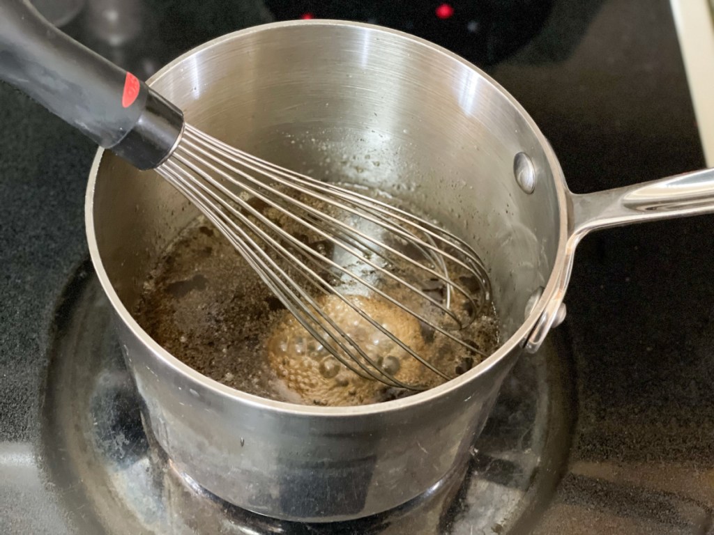 whisking sticky sauce