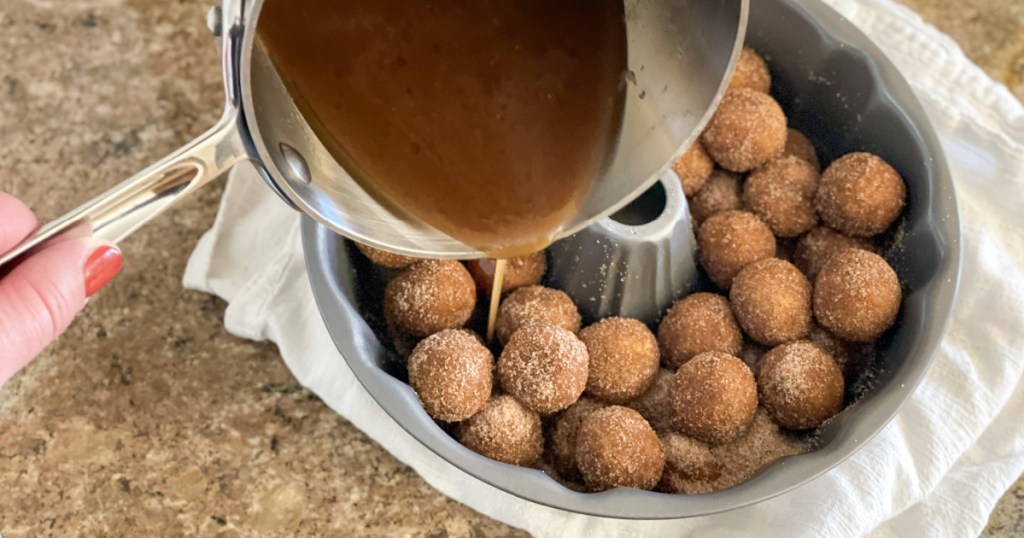 adding sticky sauce to dairy-free monkey bread dough balls 
