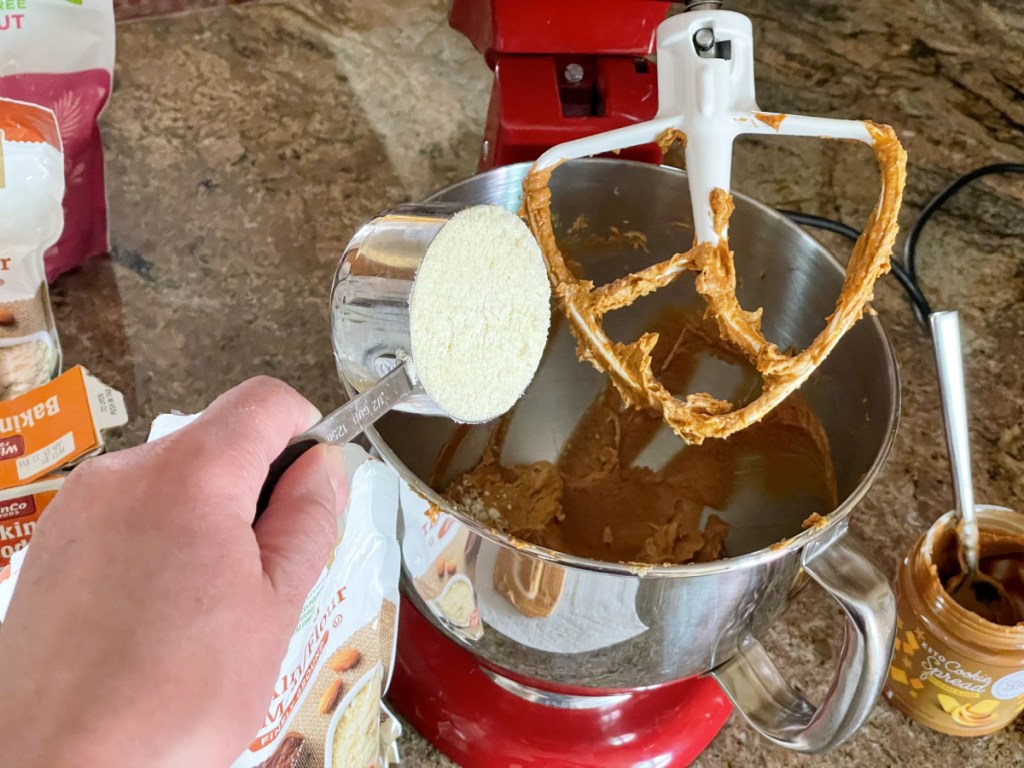 adding almond flour to cookie butter cookie batter 