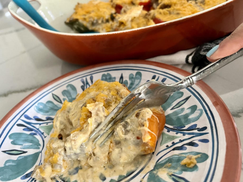 Bell peppers stuffed with cream cheese and chicken on a plate