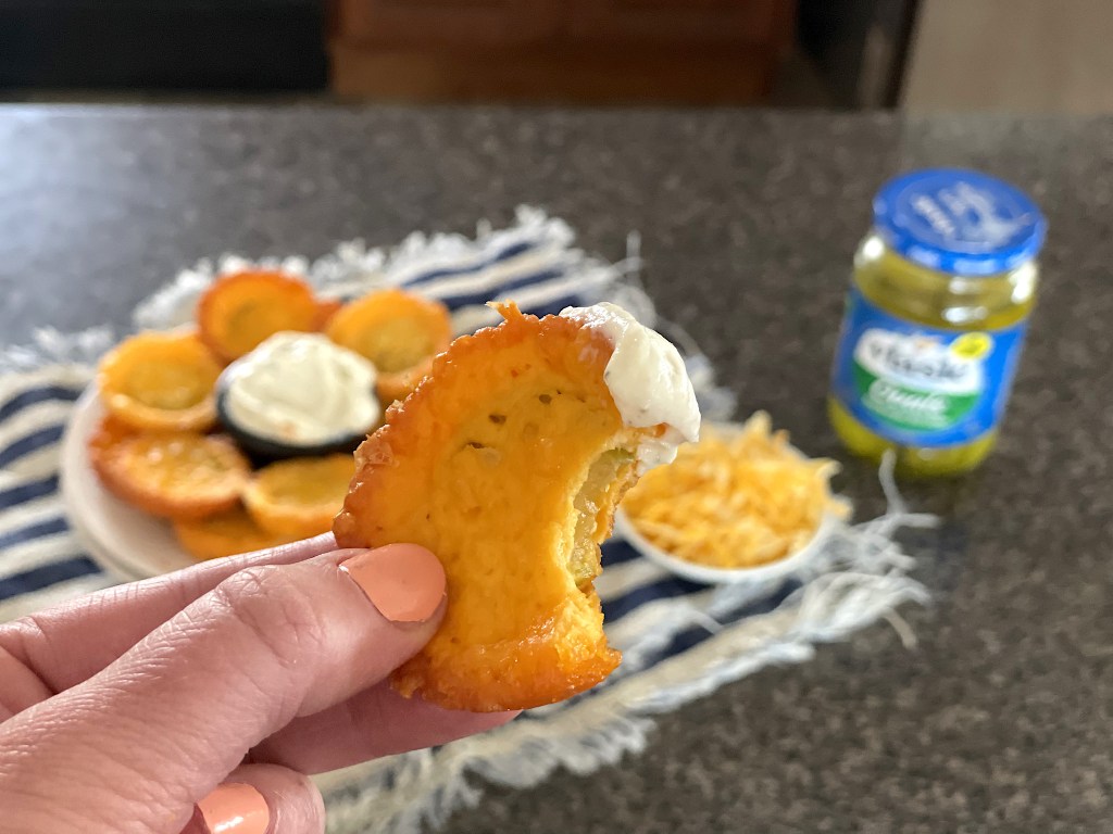 Taken bite out of cheese pickle chip