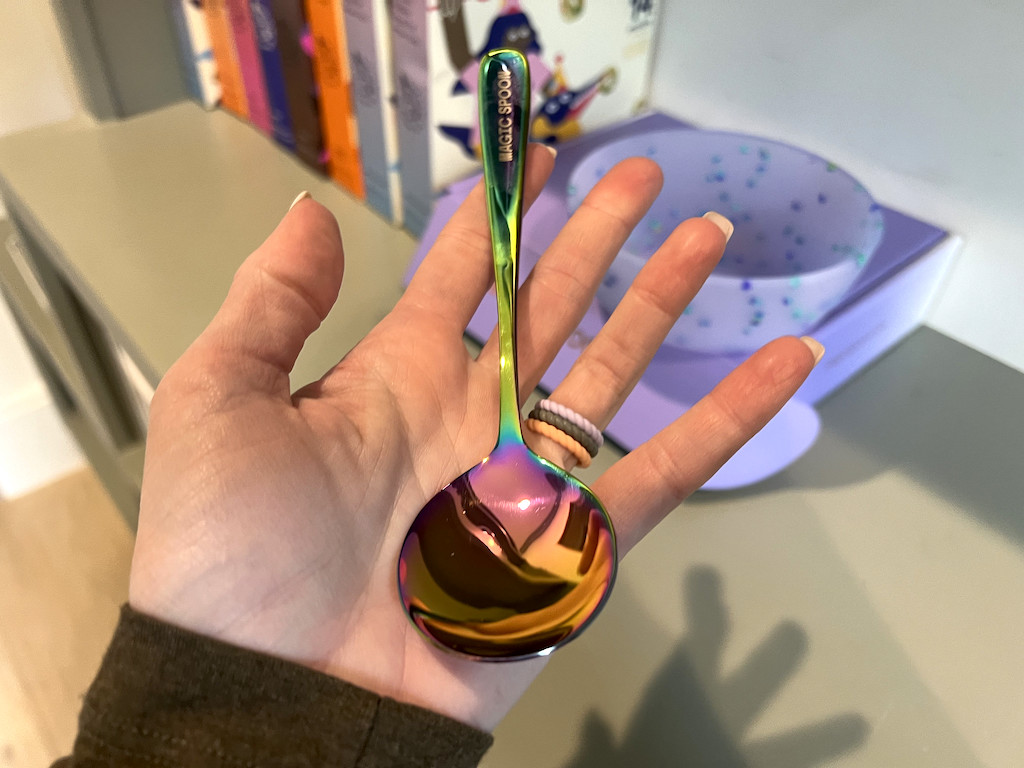 holding Magic Spoon in hand